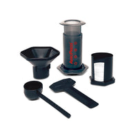 AeroPress coffee brewing device with components on a white background