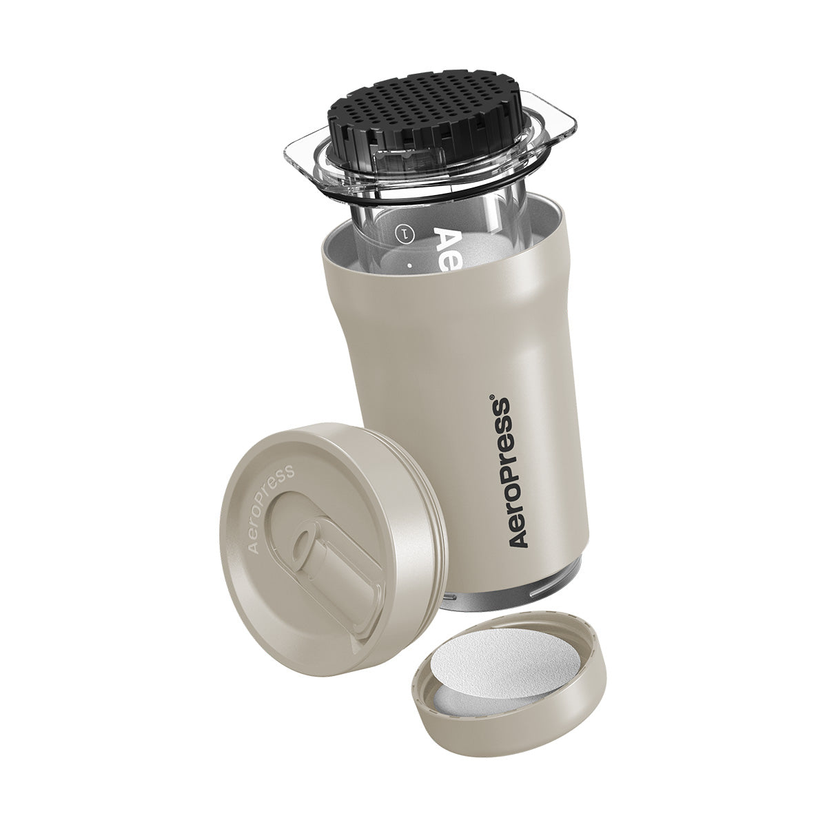 Aeropress coffee maker with components on a white background